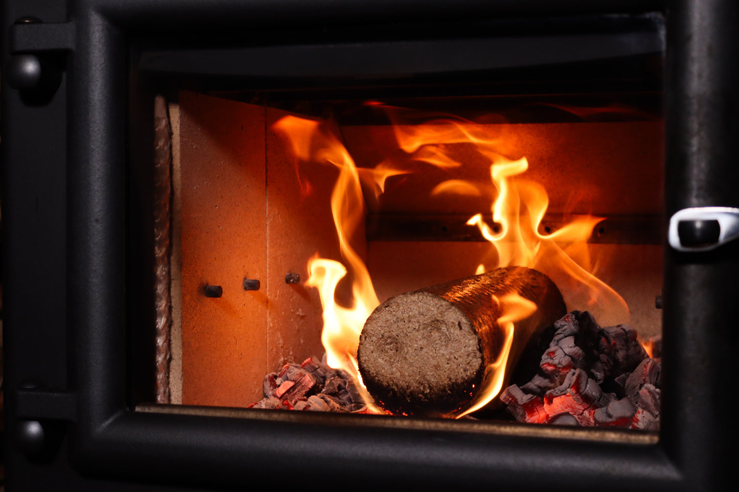 Bio Briqs firewood briquette in log burner catching on fire