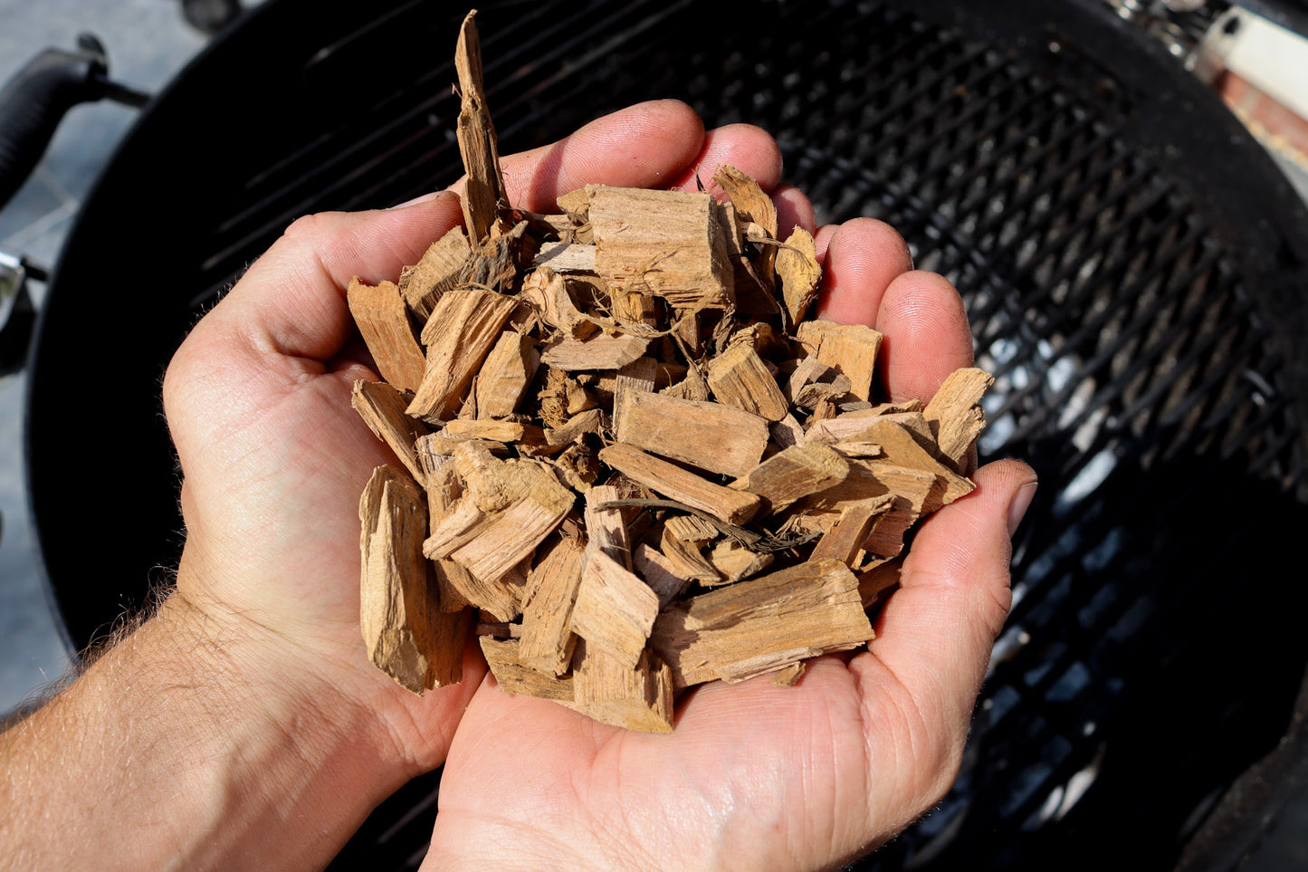 Love Logs British apple smoking chips held in cupped hands