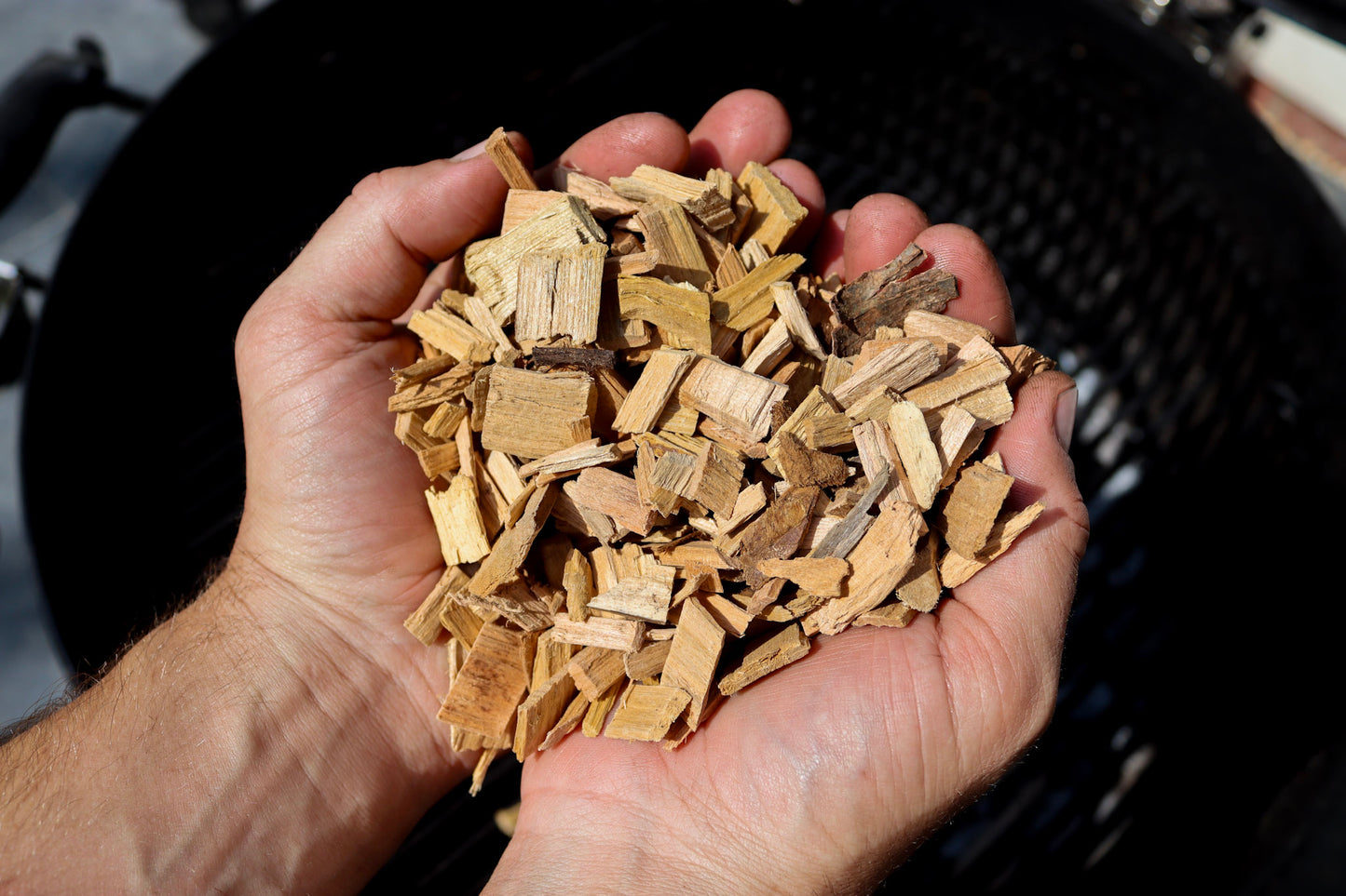 Love Logs British cherry smoking chips held in cupped hands