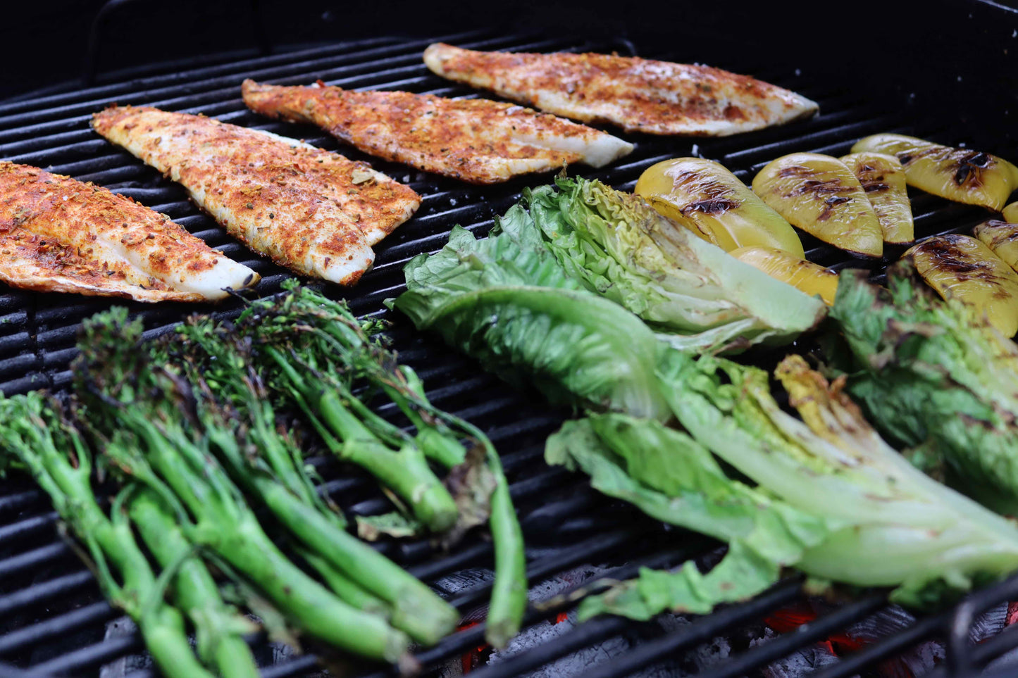 Chicken breasts, peppers and broccoli being grilled on the BBQ over Love Logs Sustainable British Charcoal