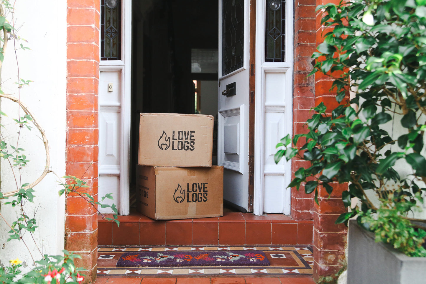 Boxes of Love Logs logs on doorstep