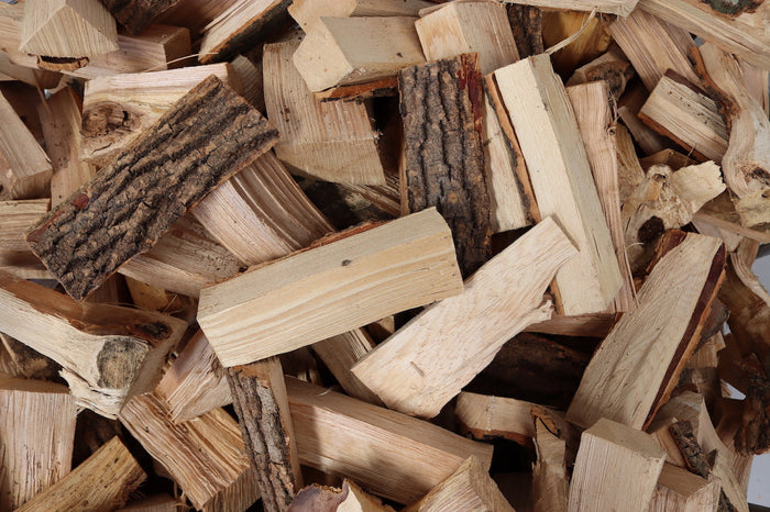 Pile of kiln-dried ash logs