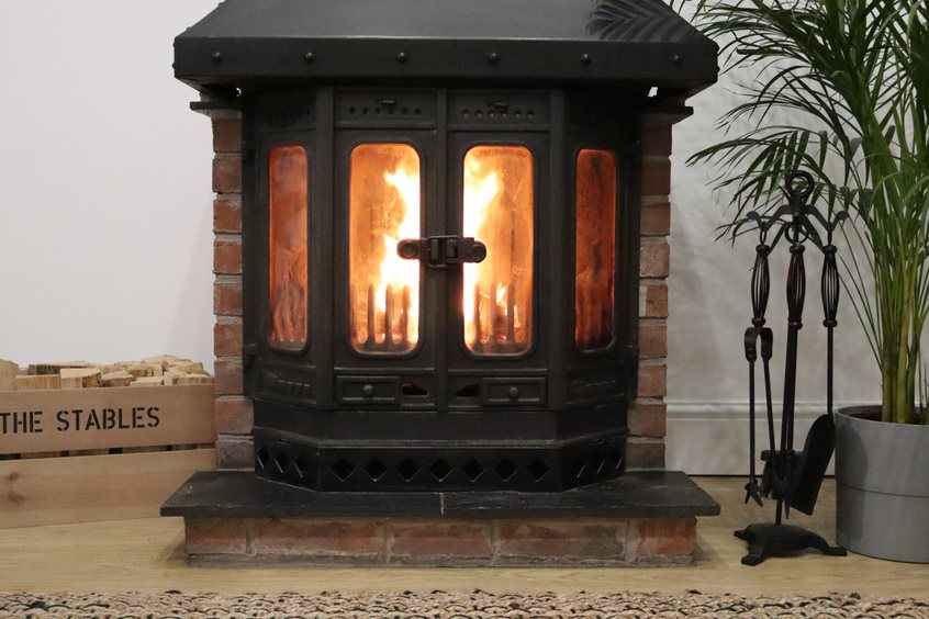 Log burner with a roaring fire inside