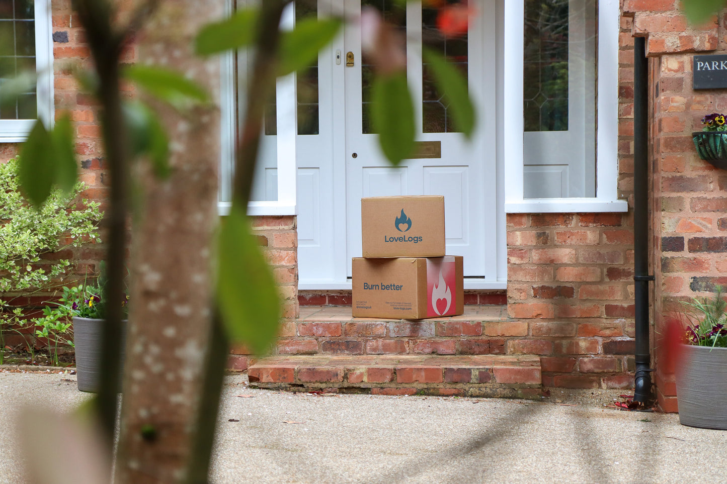 Boxes of Love Logs on Porch Step