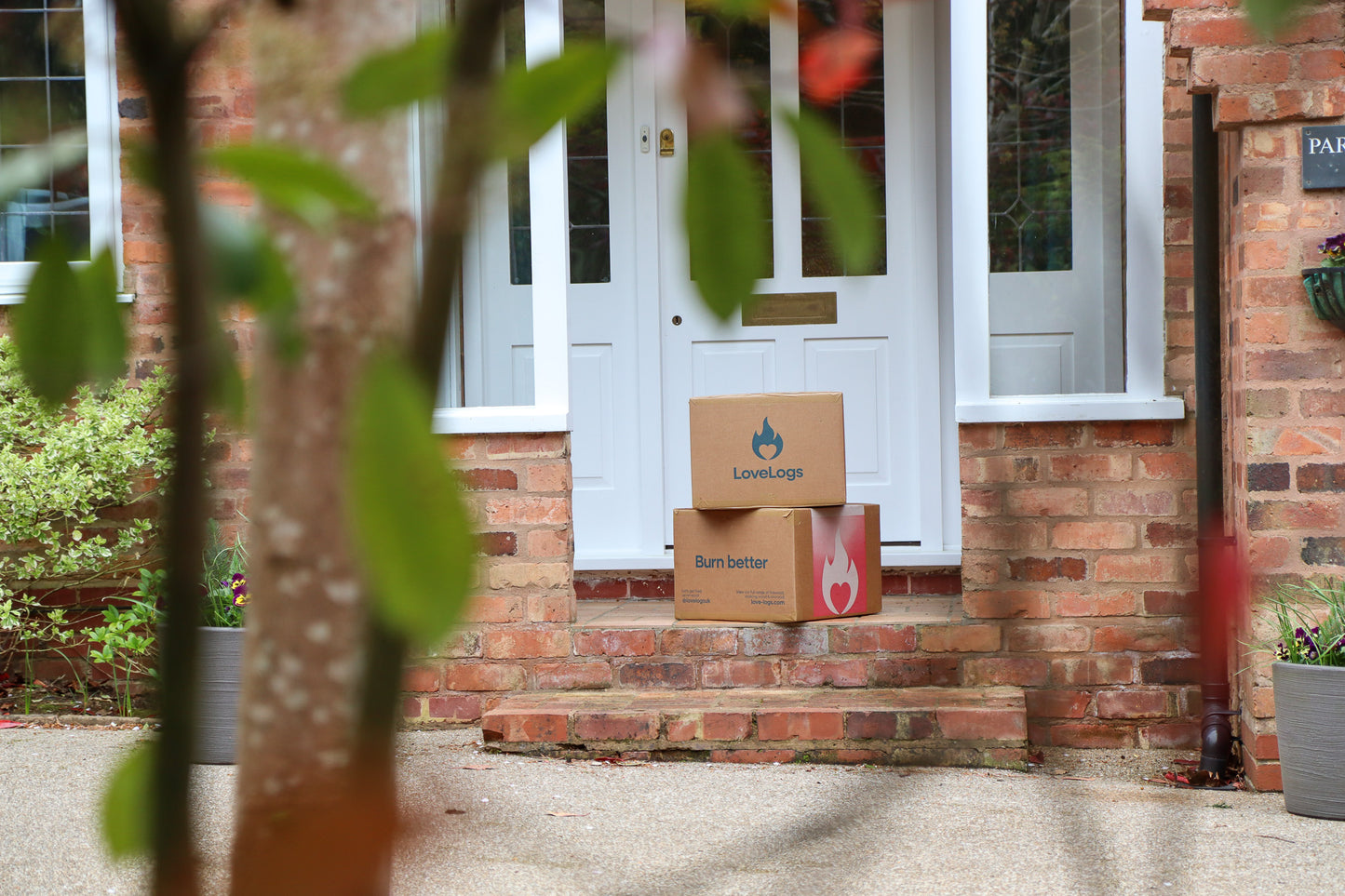 Boxes of Love Logs on Porch Step