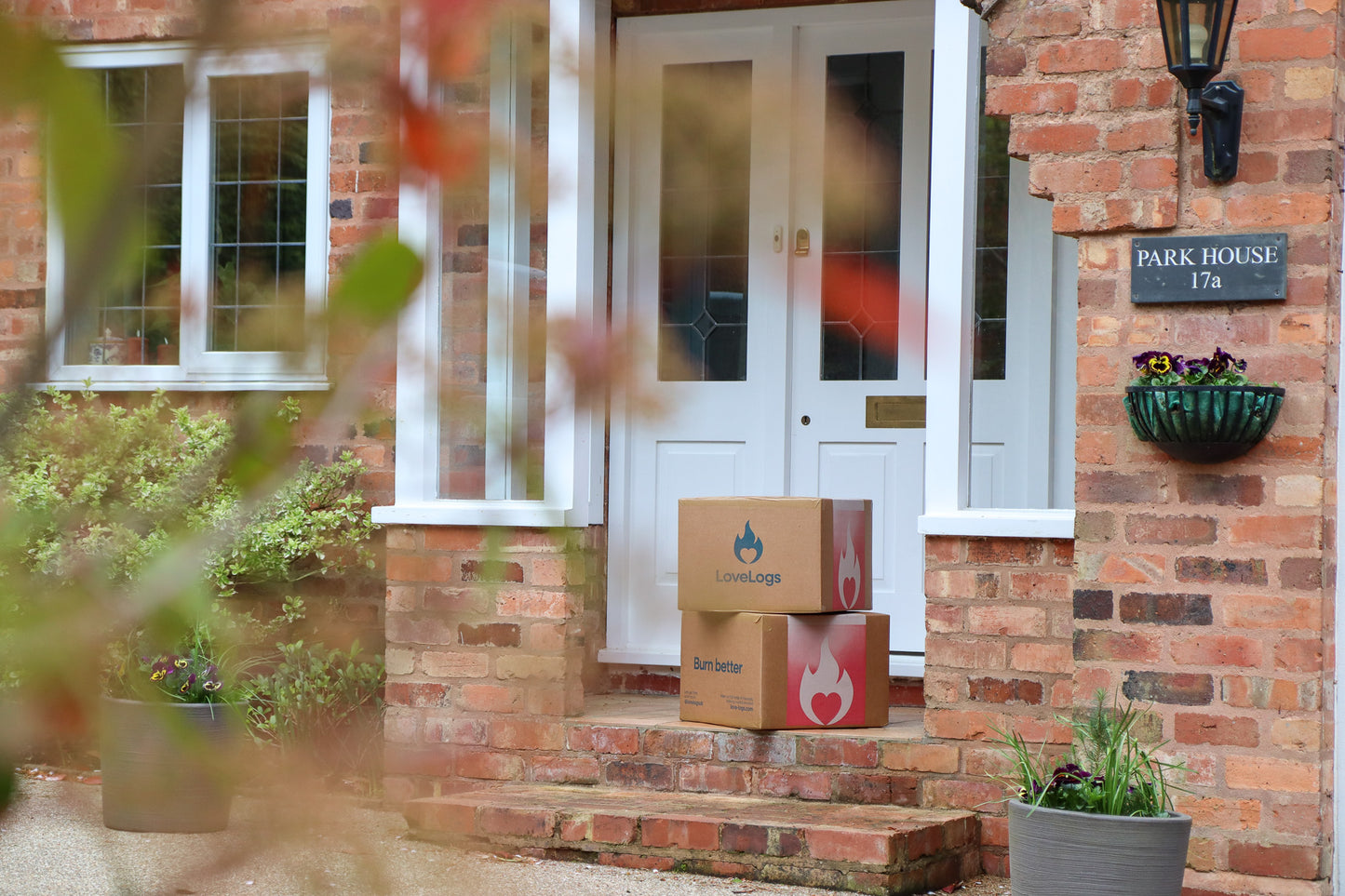 Boxes of Love Logs on Porch Step