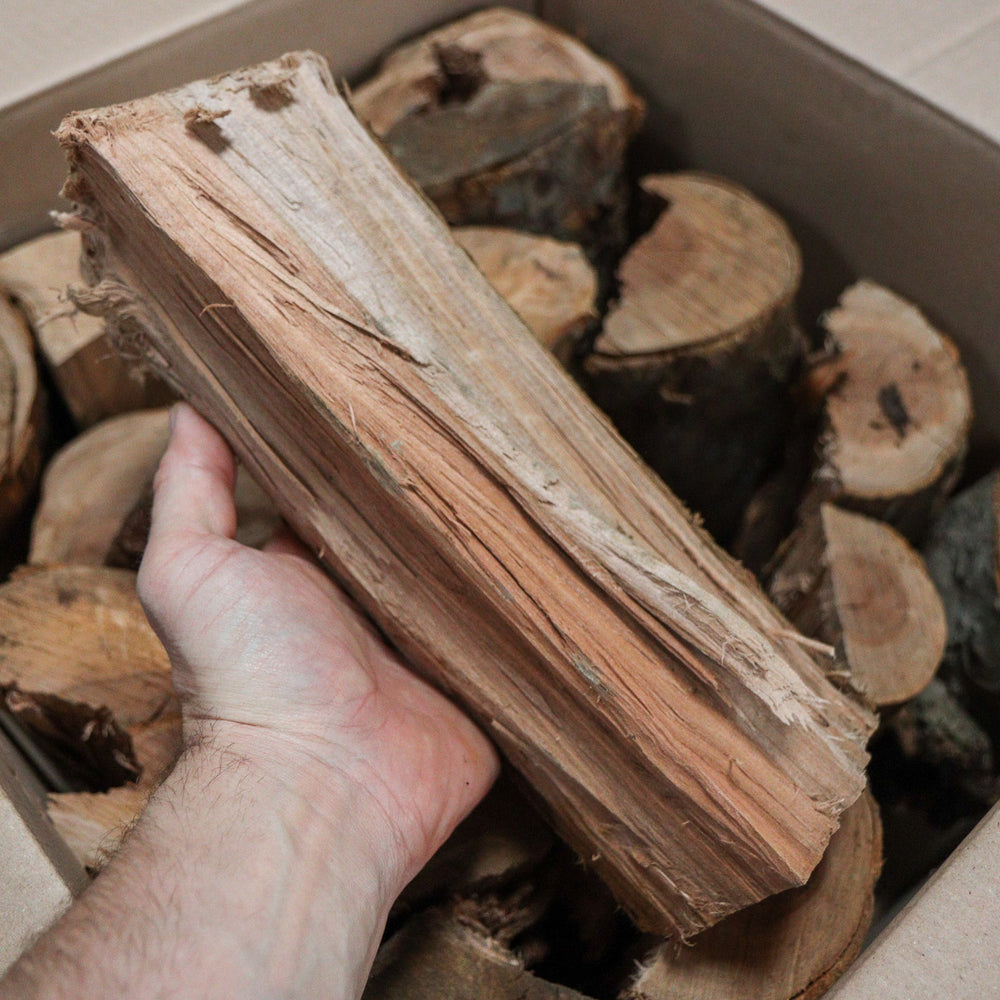 Love Logs apple wood logs in hand