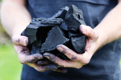 Paul holding Love Logs British charcoal in his hands